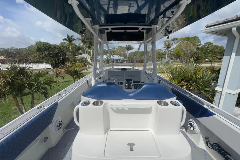 Slide: The Image of 2007 Intrepid 370 Center Console boat interior with blue seating and Garmin navigation system. - 35