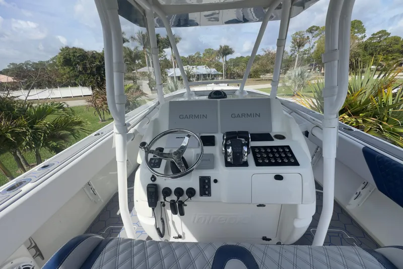 Slide: The Image of 2007 Intrepid 370 Center Console boat cockpit with Garmin navigation system. - 39
