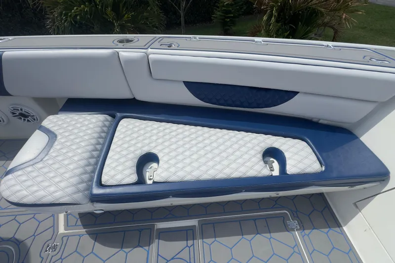 Slide: The Image of 2007 Intrepid 370 Center Console boat seating with blue and white upholstery. - 48