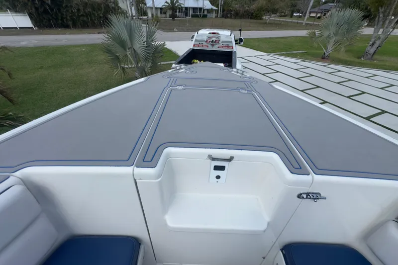 Slide: The Image of 2007 Intrepid 370 Center Console boat on trailer, parked in driveway. - 49