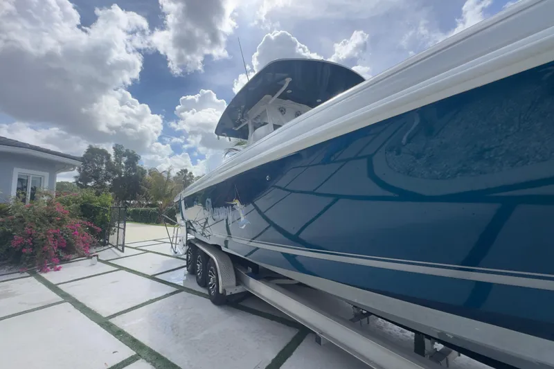 Slide: The Image of 2007 Intrepid 370 Center Console boat on trailer under cloudy sky. - 6