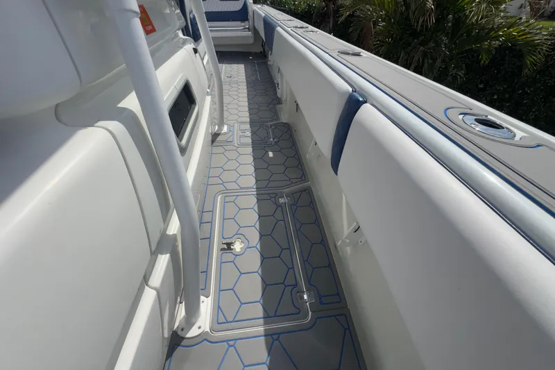 Slide: The Image of 2007 Intrepid 370 Center Console boat deck with hexagonal pattern flooring. - 60