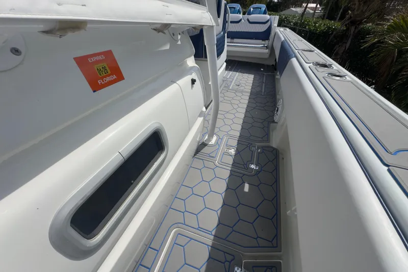 Slide: The Image of 2007 Intrepid 370 Center Console boat deck with Florida registration sticker. - 61