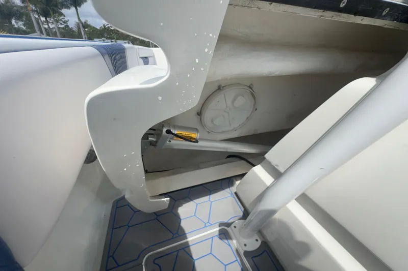 Slide: The Image of 2007 Intrepid 370 Center Console interior detail with hydraulic components and patterned flooring. - 73