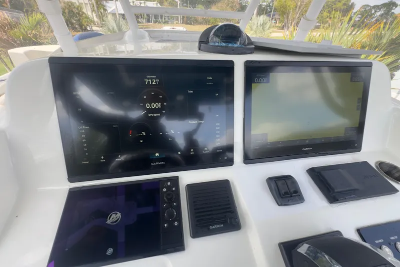 Slide: The Image of Dashboard of a 2007 Intrepid 370 Center Console with Garmin displays and controls. - 74