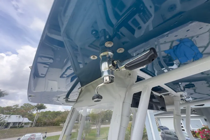 Slide: The Image of Close-up of a 2007 Intrepid 370 Center Console boat's T-top with a mounted handle. - 87