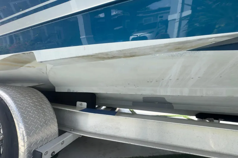 Slide: The Image of 2007 Intrepid 370 Center Console boat on trailer, showing hull and trailer details. - 9