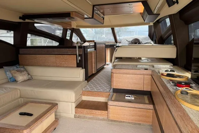 Slide: The Image of Luxurious 2014 Azimut 64 yacht deck with elegant seating and dining area at sunset. - 14