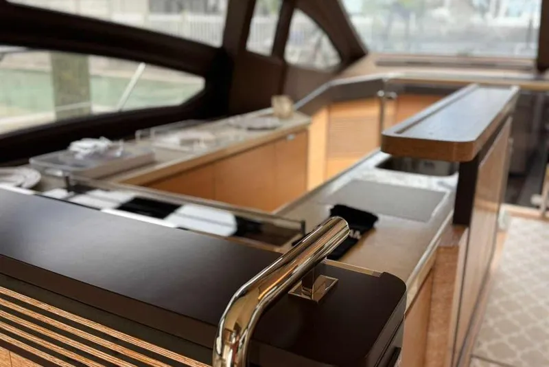 Slide: The Image of Luxurious interior of a 2014 Azimut 64 yacht with modern wood finishes. - 16