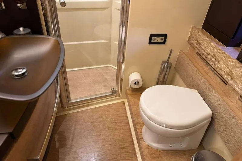 Slide: The Image of Luxurious interior of a 2014 Azimut 64 yacht with elegant seating and modern design. - 21