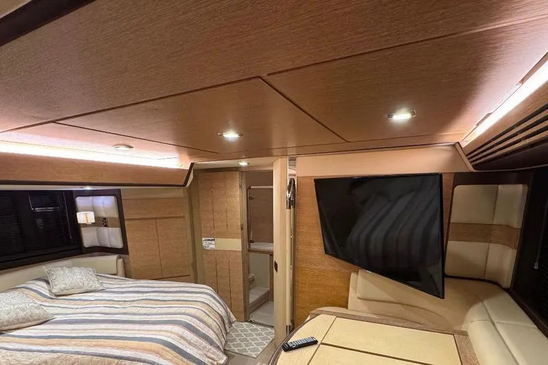 Slide: The Image of Luxurious bedroom interior of 2014 Azimut 64 yacht with modern design and cozy lighting. - 25