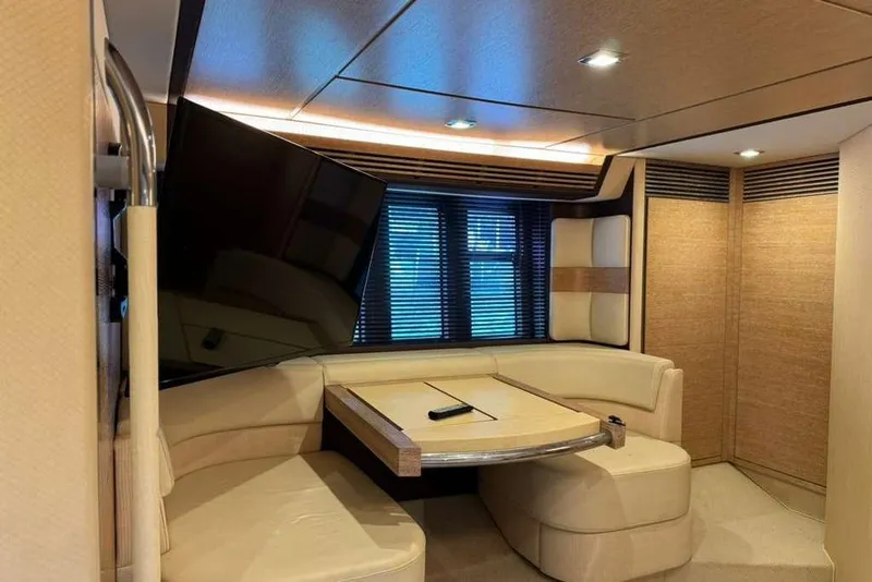 Slide: The Image of Luxurious interior of a 2014 Azimut 64 yacht with plush seating and modern decor. - 28