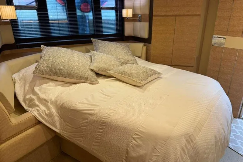 Slide: The Image of Luxurious bedroom interior of 2014 Azimut 64 yacht with elegant bedding and ambient lighting. - 29