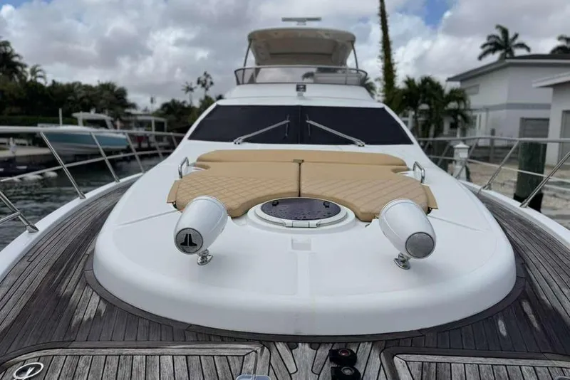 Slide: The Image of 2014 Azimut 64 yacht with blue underwater lights at night. - 4