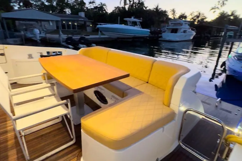 Slide: The Image of Helm of 2014 Azimut 64 yacht with beige captain's chair and control panel. - 8