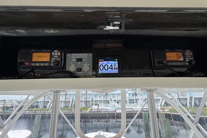 Slide: The Image of 1988 Buddy Davis 47 Convertible cockpit with navigation and communication equipment. - 11