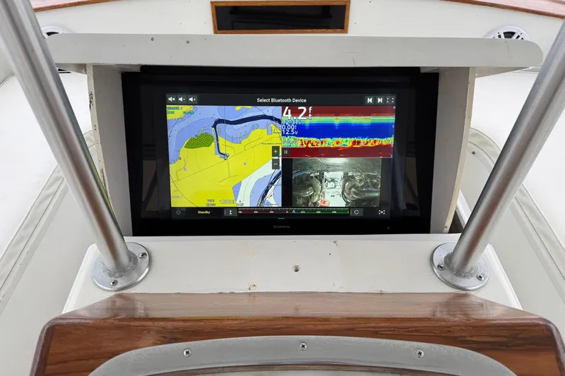 Slide: The Image of Navigation display on 1988 Buddy Davis 47 Convertible boat, showing maps and sonar data. - 12