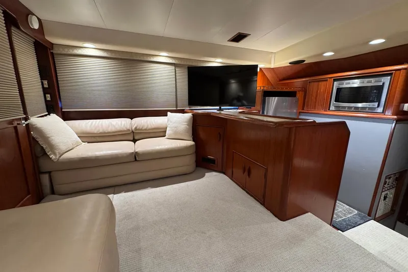 Slide: The Image of Luxurious interior of a 1988 Buddy Davis 47 Convertible yacht with leather seating and modern amenities. - 17