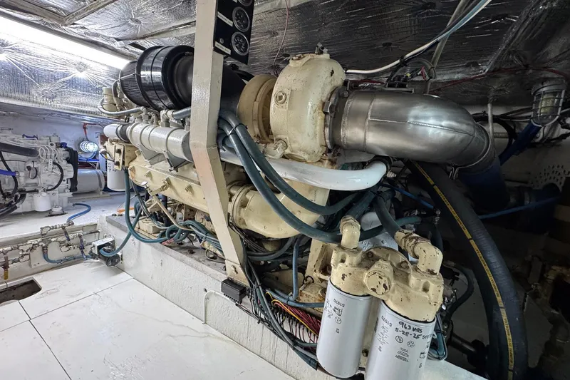 Slide: The Image of Engine room of a 1988 Buddy Davis 47 Convertible yacht, showcasing detailed machinery. - 40