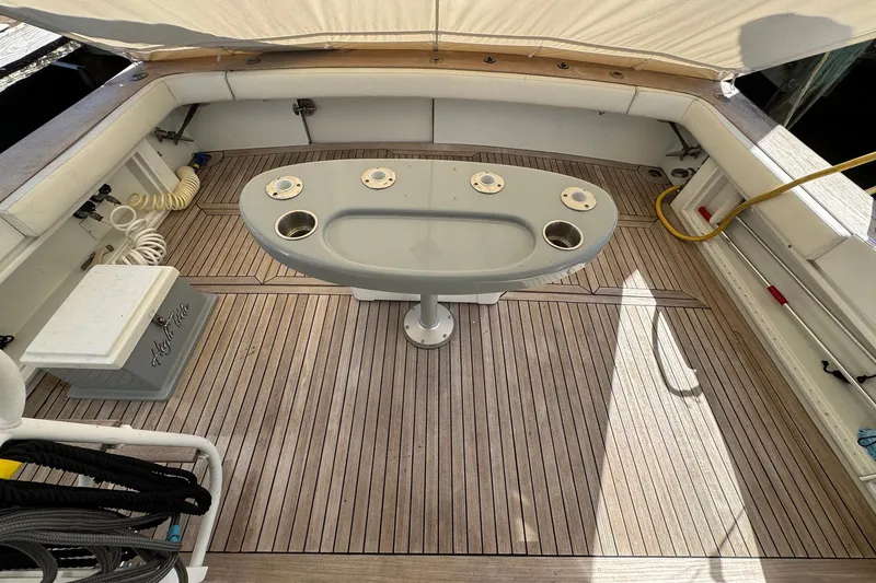 Slide: The Image of 1988 Buddy Davis 47 Convertible boat deck with fishing table and teak flooring. - 7
