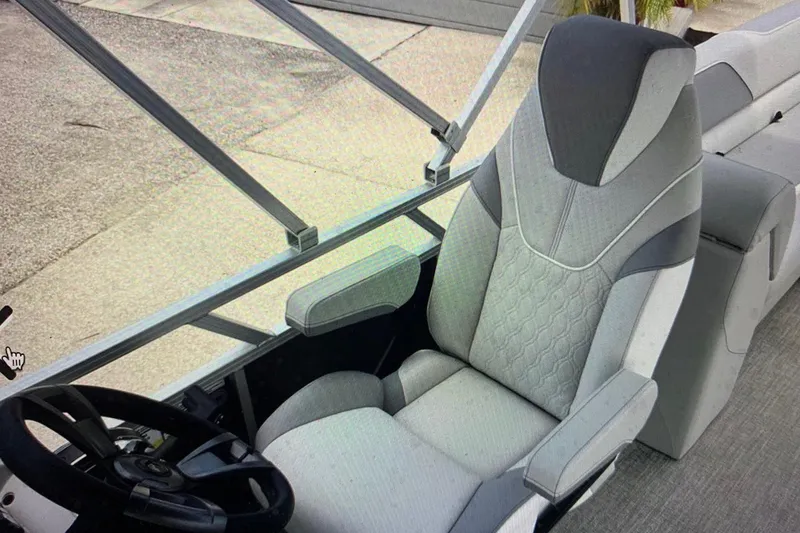 Slide: The Image of 2025 Avalon 2585 Venture boat interior with high-performance seating and steering wheel. - 8