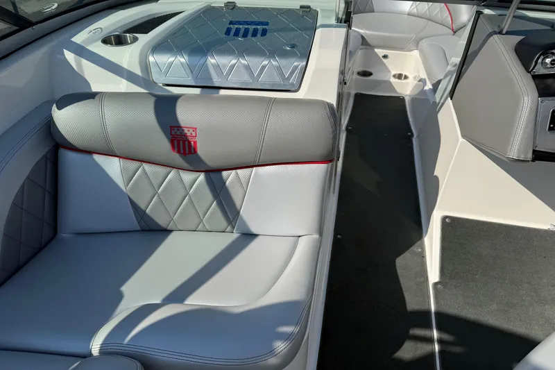 Slide: The Image of 2013 MasterCraft X10 boat interior with gray seating and diamond stitching. - 6