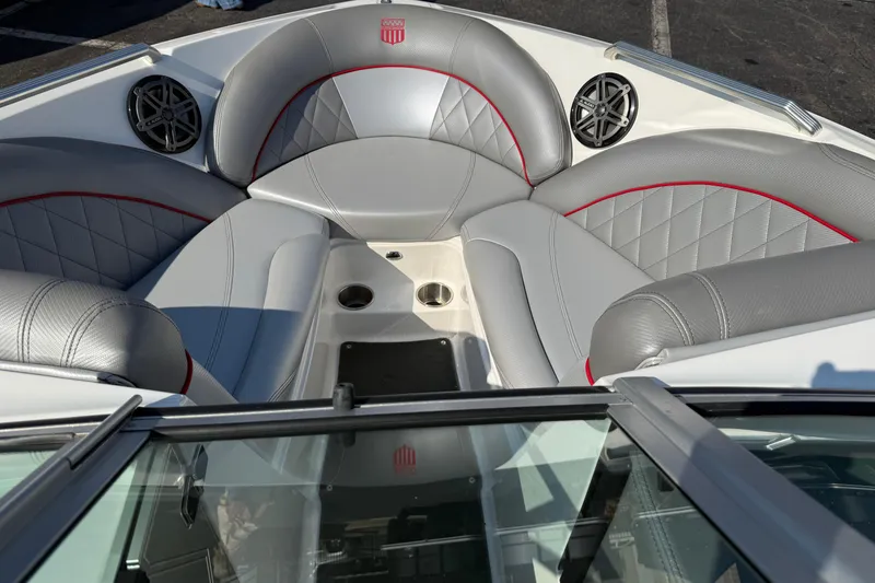 Slide: The Image of 2013 MasterCraft X10 boat interior with gray seating and speakers. - 7