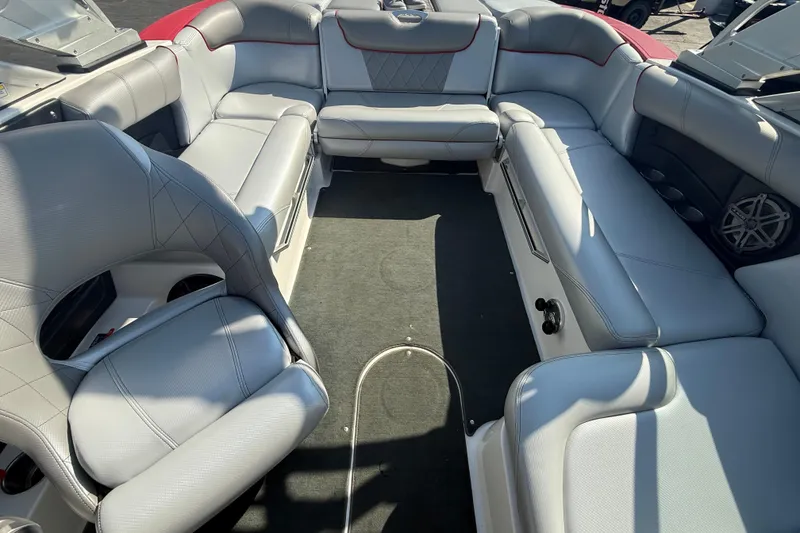Slide: The Image of 2013 MasterCraft X10 boat interior with spacious gray seating and modern design. - 8