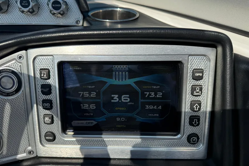 Slide: The Image of Dashboard of a 2013 MasterCraft X10 boat displaying speed, temperature, and other metrics. - 9