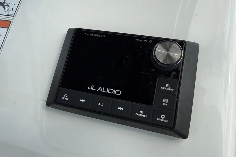 Slide: The Image of 2025 Shallow Sport boat featuring JL Audio MediaMaster display with control buttons. - 18