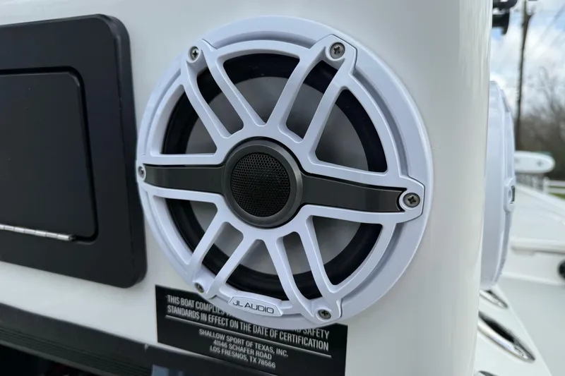 Slide: The Image of 2025 Shallow Sport boat with JL Audio speaker, close-up view. - 19