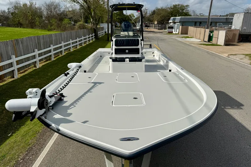 Slide: The Image of 2025 Shallow Sport boat with sleek design, parked on a residential street. - 6