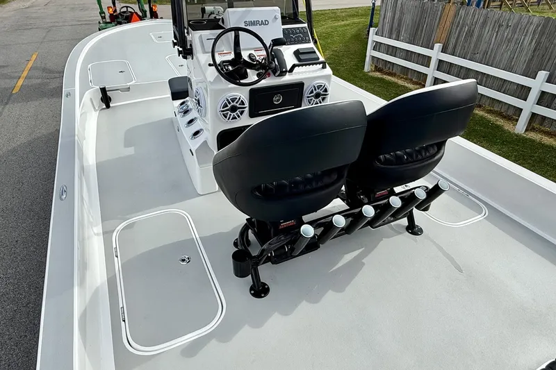 Slide: The Image of 2025 Shallow Sport boat interior with dual seats and modern control panel. - 8