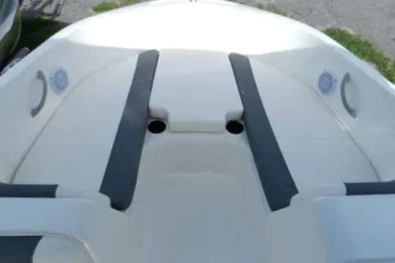 Slide: The Image of 2026 Bayliner Element E18 boat interior with seating and cup holders. - 5