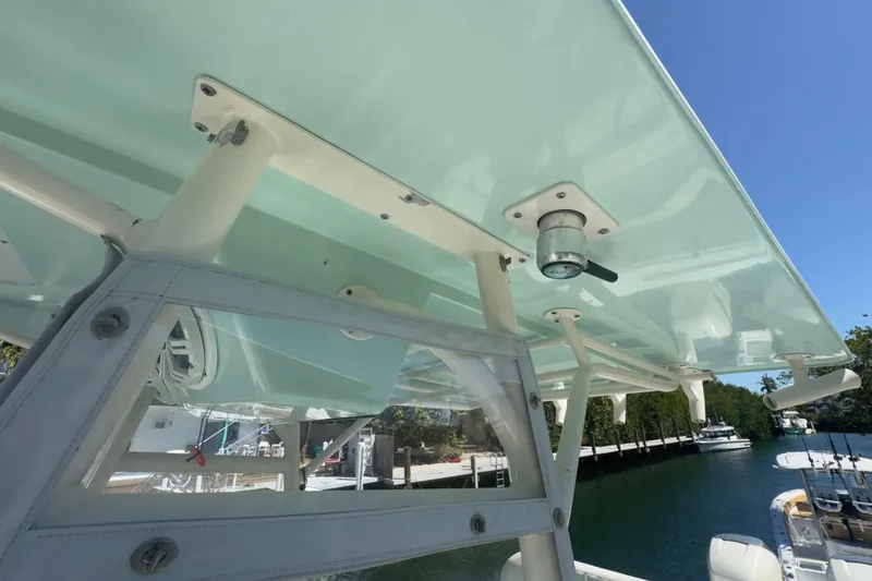 Slide: The Image of 2000 Pursuit 2870 Center Console boat with a sturdy T-top and clear enclosure. - 16