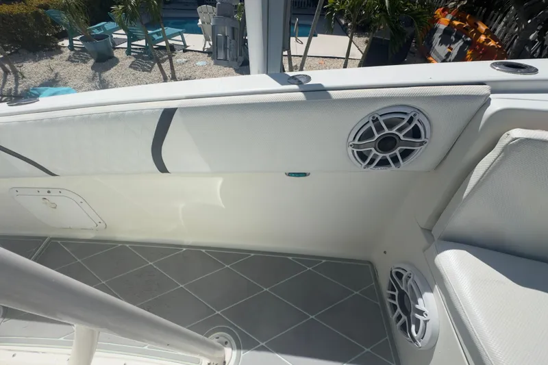 Slide: The Image of 2000 Pursuit 2870 Center Console boat interior with speakers and seating. - 20