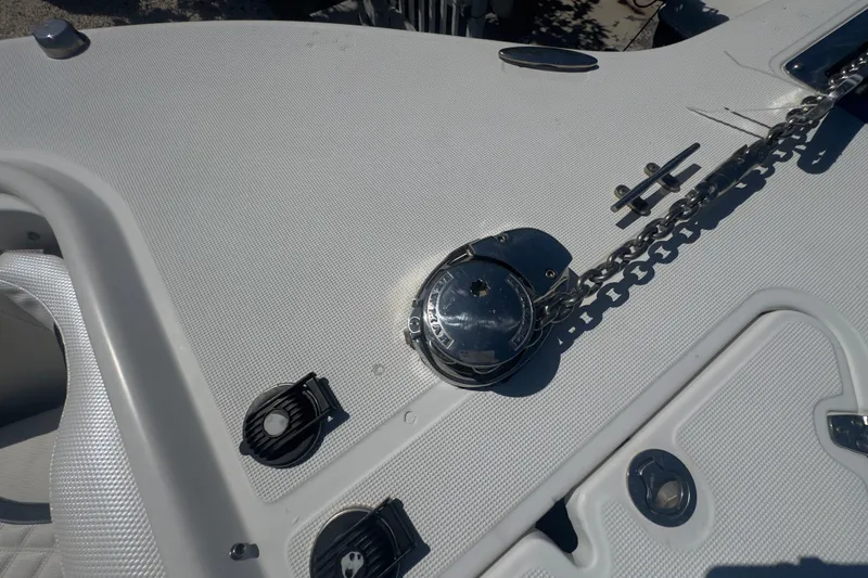 Slide: The Image of 2000 Pursuit 2870 Center Console boat deck with anchor chain and cleats. - 31