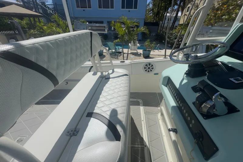 Slide: The Image of 2000 Pursuit 2870 Center Console boat interior with steering wheel and seating. - 40