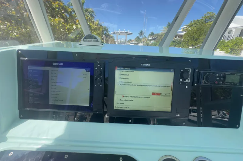 Slide: The Image of Pursuit 2870 Center Console 2000 dashboard with Simrad navigation displays. - 8
