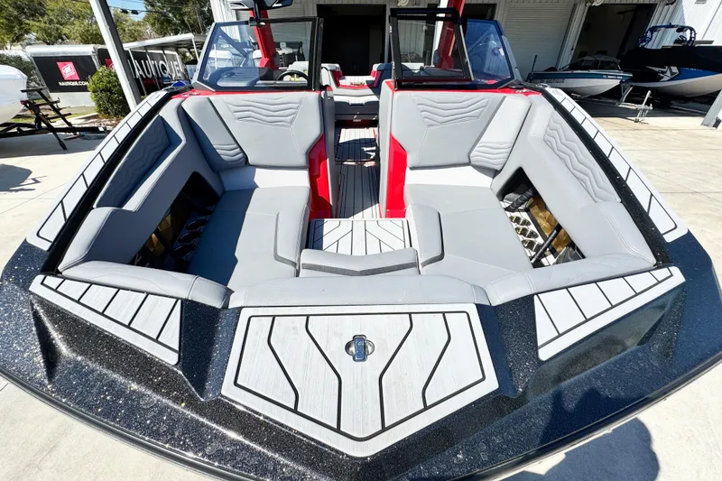 Slide: The Image of 2025 Nautique Super Air Nautique G23 Coastal Edition boat interior with sleek seating design. - 6
