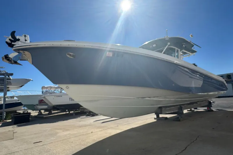 Slide: The Image of 2008 Everglades 350 Center Console boat on dry dock under clear blue sky. - 11