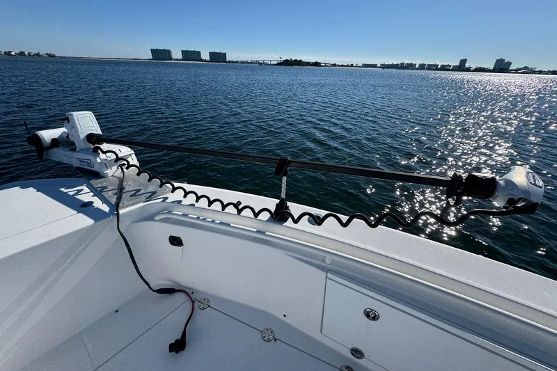 Slide: The Image of 2008 Everglades 350 Center Console boat on water, featuring a trolling motor. - 13