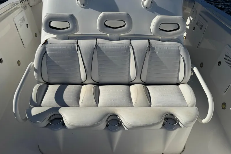 Slide: The Image of 2008 Everglades 350 Center Console boat seating with cup holders and headrests. - 20