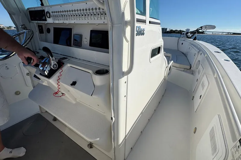 Slide: The Image of 2008 Everglades 350 Center Console boat interior with control panel and seating area. - 25