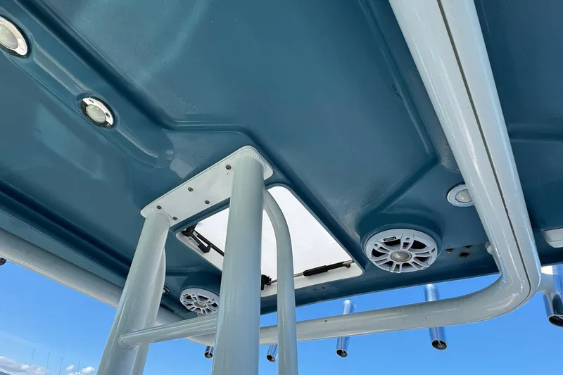 Slide: The Image of 2008 Everglades 350 Center Console boat roof with speakers and rod holders. - 26