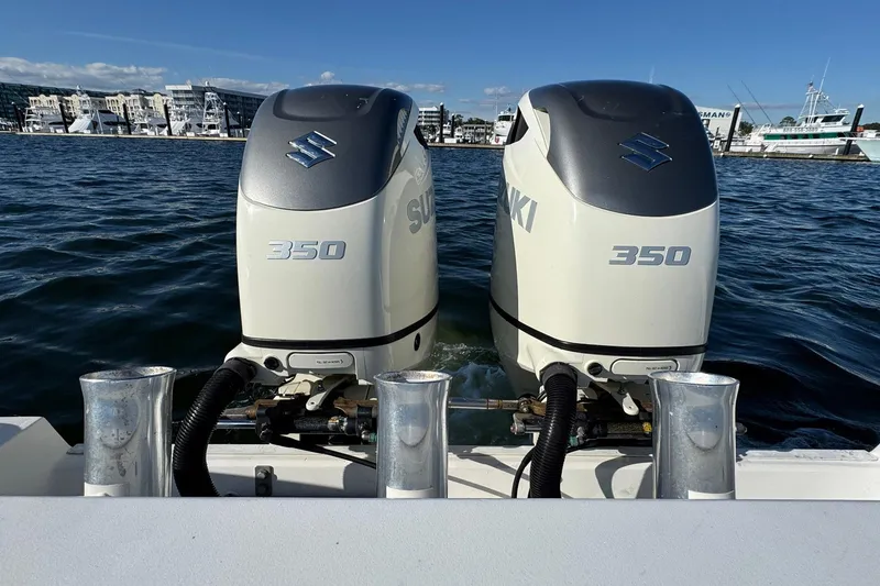 Slide: The Image of Twin Suzuki 350 outboard engines on a 2008 Everglades 350 Center Console boat. - 38