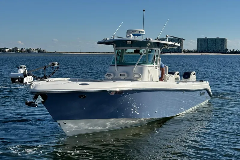 Slide: The Image of 2008 Everglades 350 Center Console boat on calm water, clear sky background. - 5