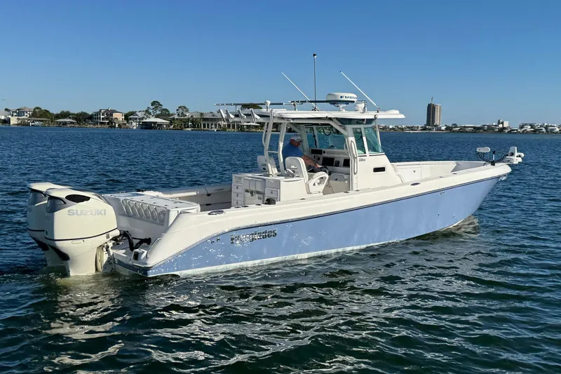 Slide: The Image of 2008 Everglades 350 Center Console boat on water, featuring Suzuki outboard engines. - 8
