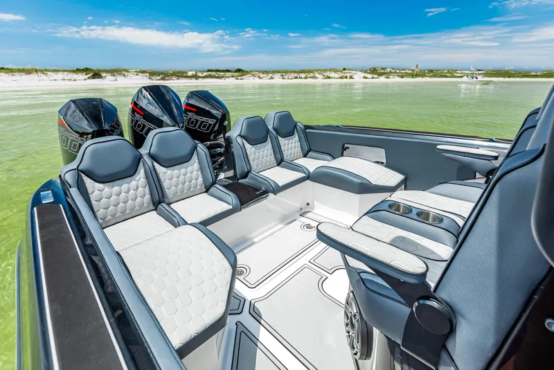 Slide: The Image of Luxurious 2025 Glasstream 36 boat interior with sleek seating and powerful engines, set against a serene water backdrop. - 10