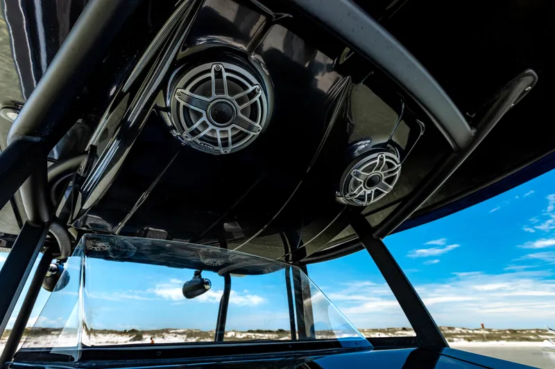 Slide: The Image of 2025 Glasstream 36 boat speakers and canopy against a clear blue sky. - 12